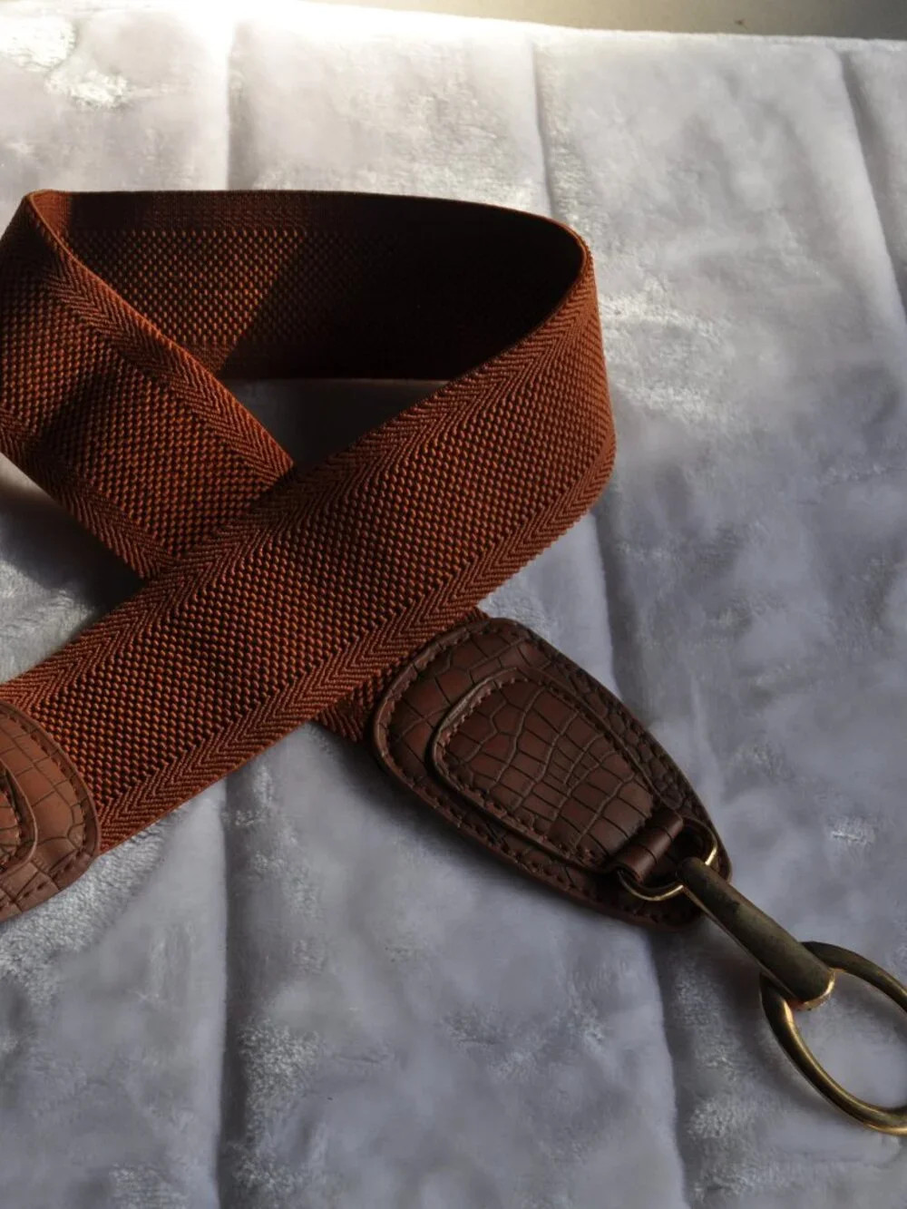 Women's brown Vince Camuto faux leather elastic wide belt features a gold circle